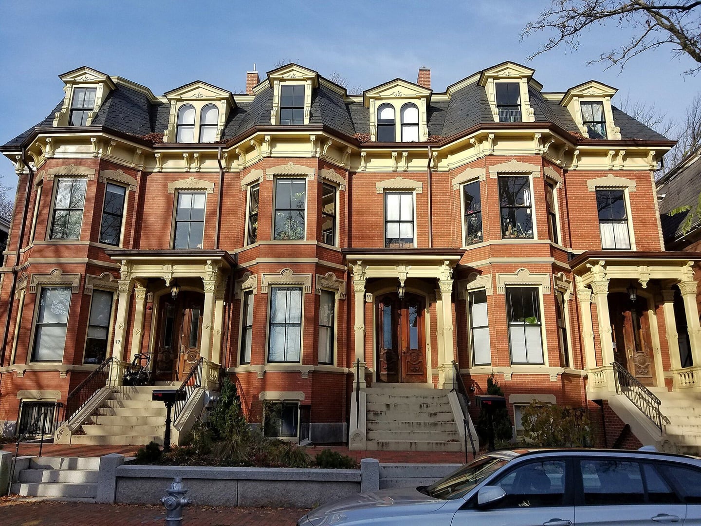 Brick row houses with front steps in Cambridge, Massachusetts